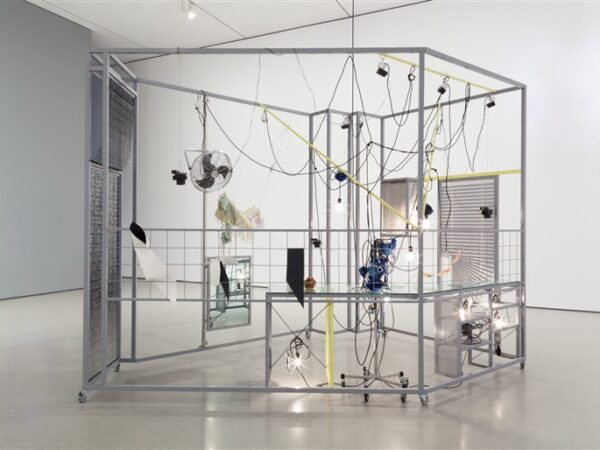 Haegue Yang. Sallim. 2009. Steel frame, perforated metal plate, caster, aluminum venetian blinds, knitting yarn, acrylic mirror, IV stand, light bulbs, cable, electric fan, timer, garlic, dishes, hot pad, and scent emitter. 8′ 2 1/2″ x 13′ 9 3/8″ x 10′ 2″ (250 x 420 x 310 cm). The Museum of Modern Art, New York. Fund for the Twenty-First Century and gift of Agnes Gund, Glenn Fuhrman, and Jerry I. Speyer. © 2023 Haegue Yang